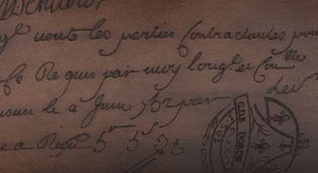 フランス語の文字が描かれたベルルッティブリーフケース